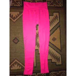 Hot pink laser cut yoga pants.